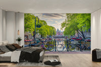 Charming Amsterdam canal-side scene with vibrant bicycles for your space.

