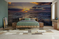 Coastal sunset wall mural with warm golden hues and gentle waves.

