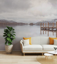 Misty morning pier mural with reflections in calm water.

