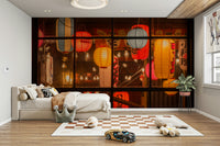 Red and orange lanterns behind window mural

