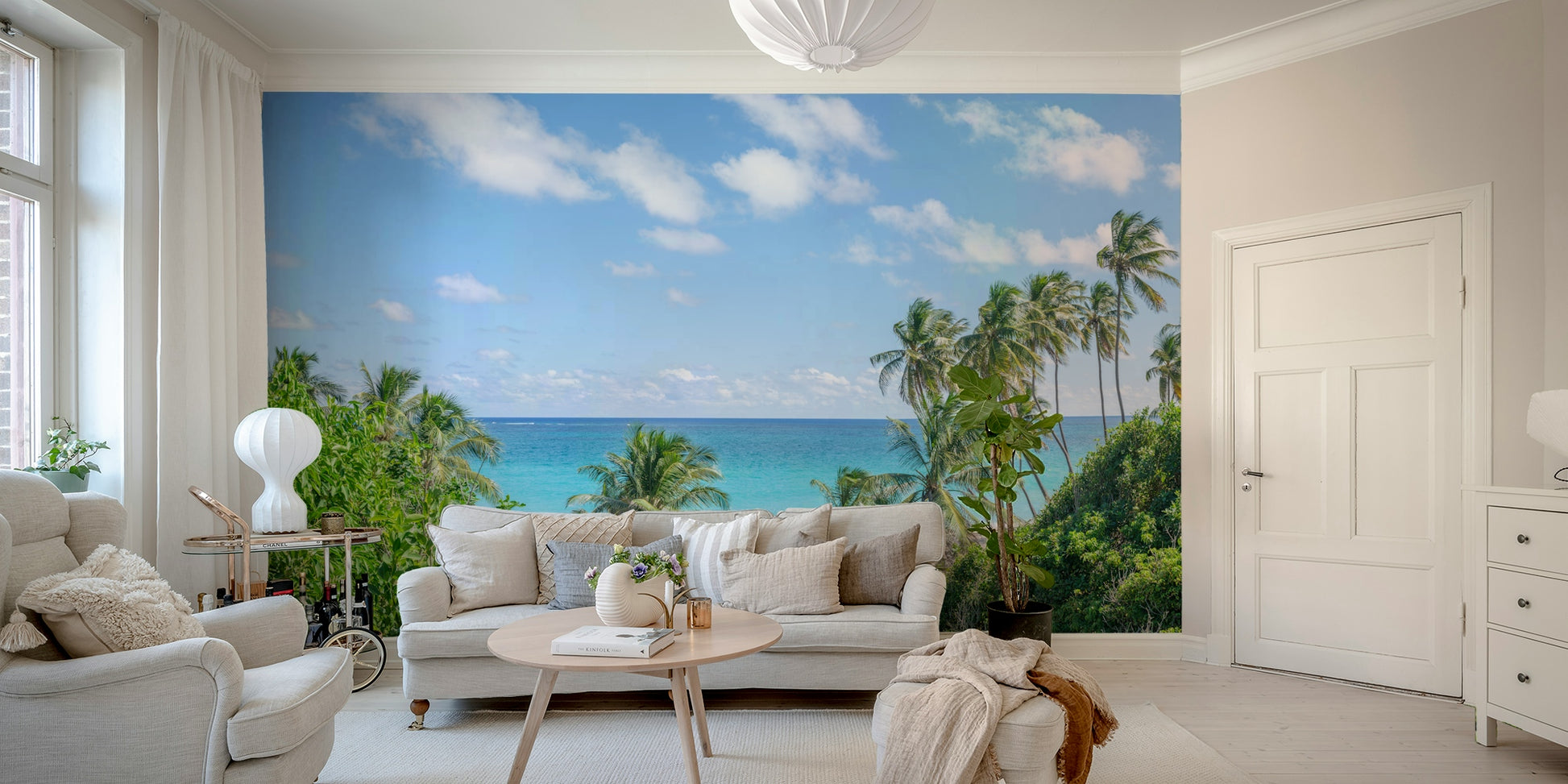 Bright and fresh coastal mural wallpaper with green palms.

