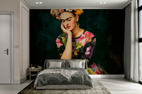 Stylized female figure in floral crown on mural wall

