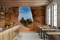 Rugged rock wall mural with blue sky
