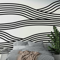 Contemporary monochrome mural featuring flowing wave lines.

