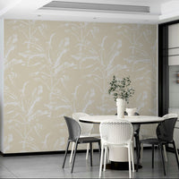 Soft yellow mural wallpaper with leaf patterns

