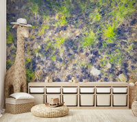 The grass is interspersed with rich, dark brown and black earth.

