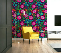 Vibrant rainbow-colored tropical flowers on a deep purple background.

