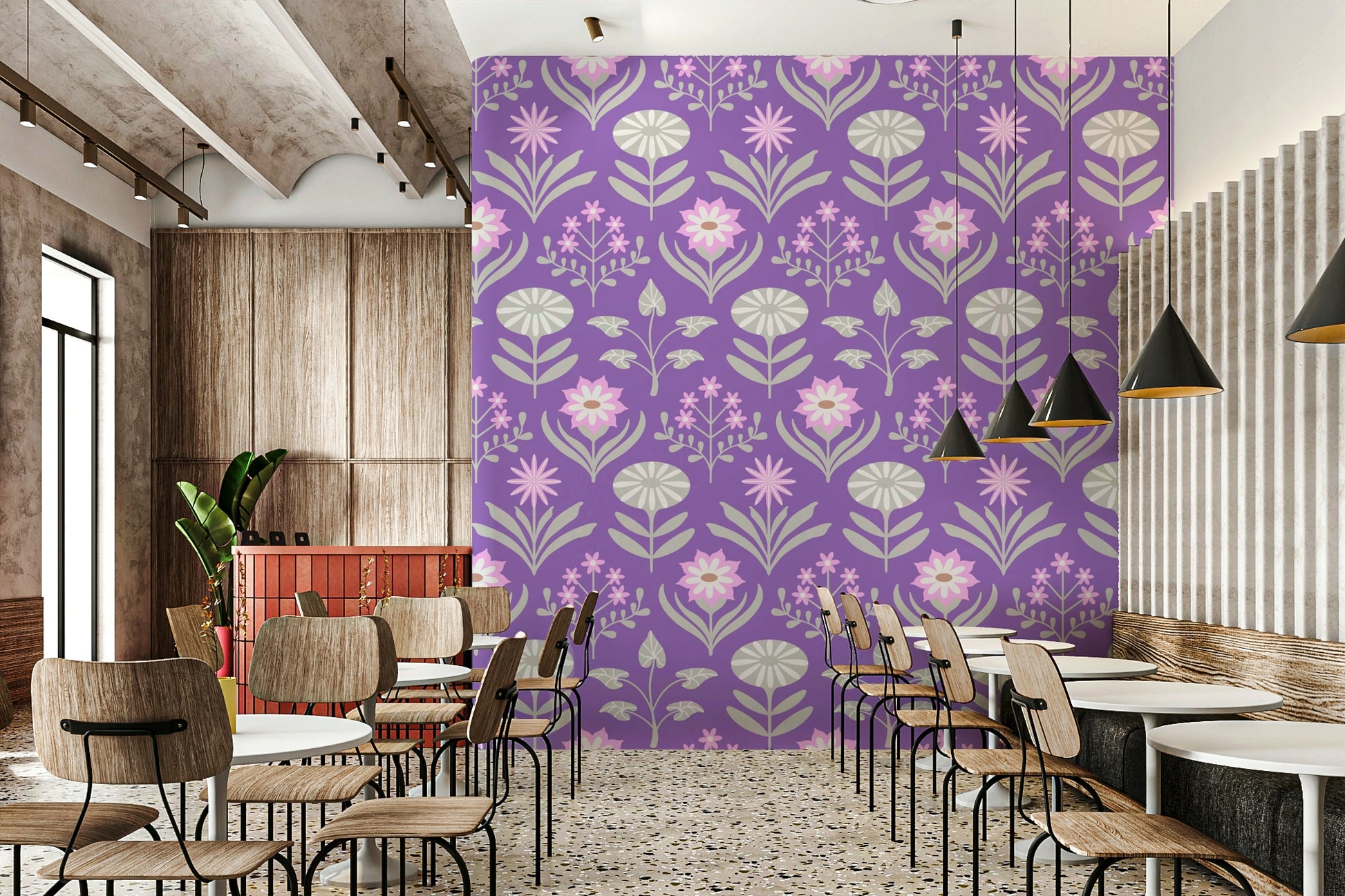 Stylized floral and leaf patterns in pink, gray, and purple on a wall.

