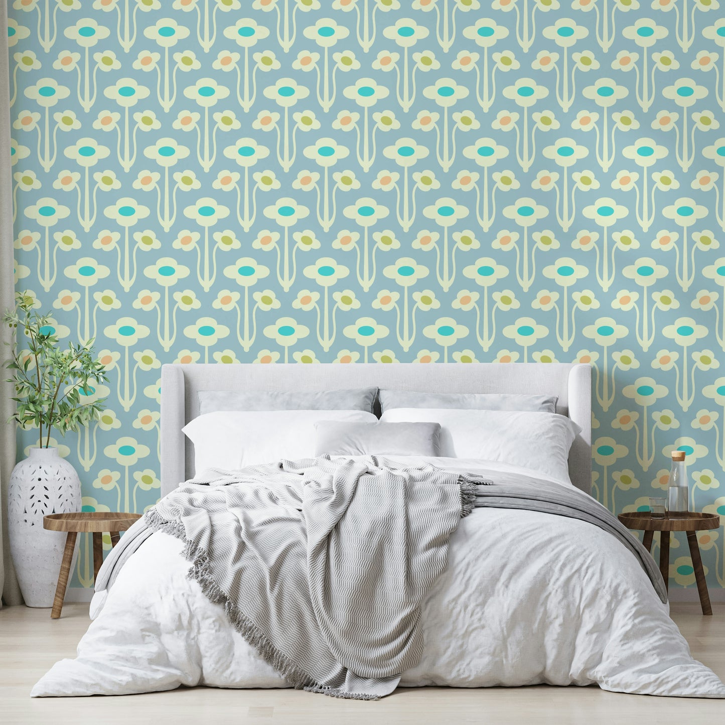 Stylized floral and leaf patterns in cream, pastel, and lavender purple on a wall.

