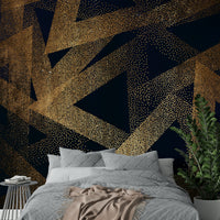 Silhouetted figures dancing in a wall mural.

