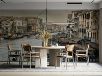 Historic buildings in beige and ochre along the canal.

