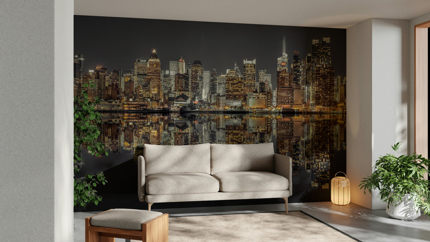 Panoramic view of a city skyline at night.

