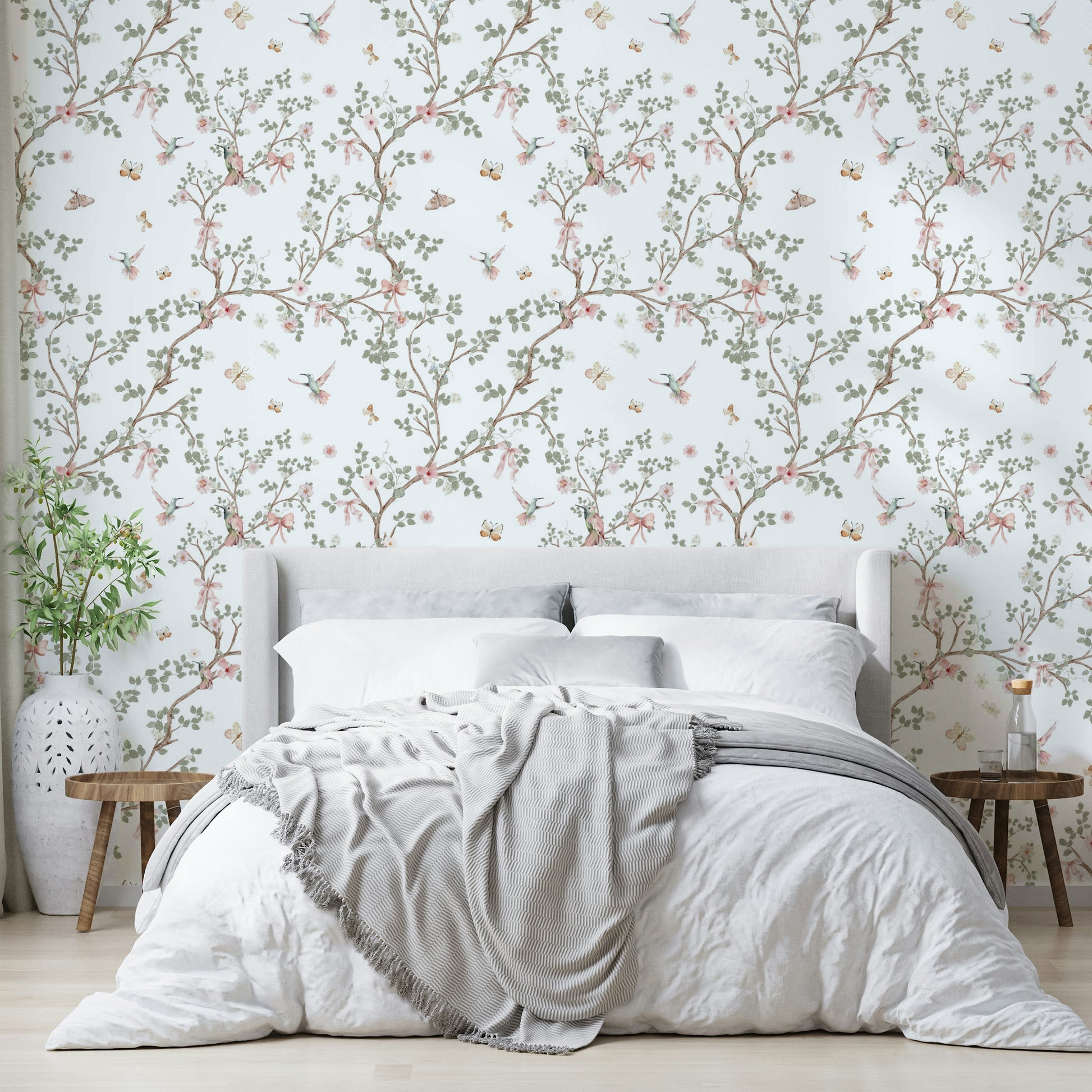 Design featuring graceful hummingbirds and delicate blossoms.

