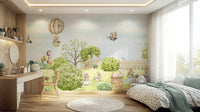 Wall mural showing a forest scene with playful animals.

