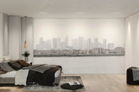 The color palette is composed of muted grays, soft blues, and subtle, diffused lights from the city.
