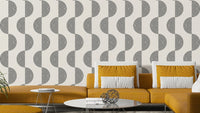 The design features layered or repeating abstract shapes.

