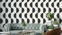 A modern wall mural with a repeating monochrome wave pattern.

