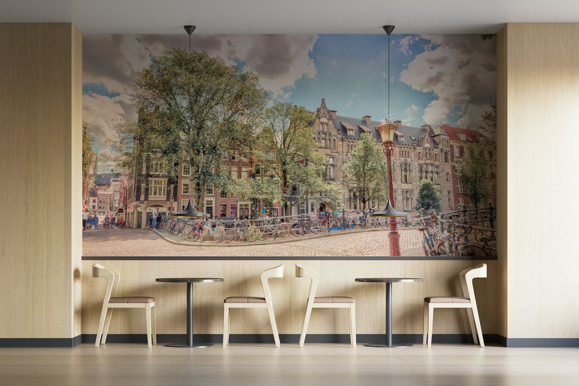 The image features classic European buildings and a large tree.

