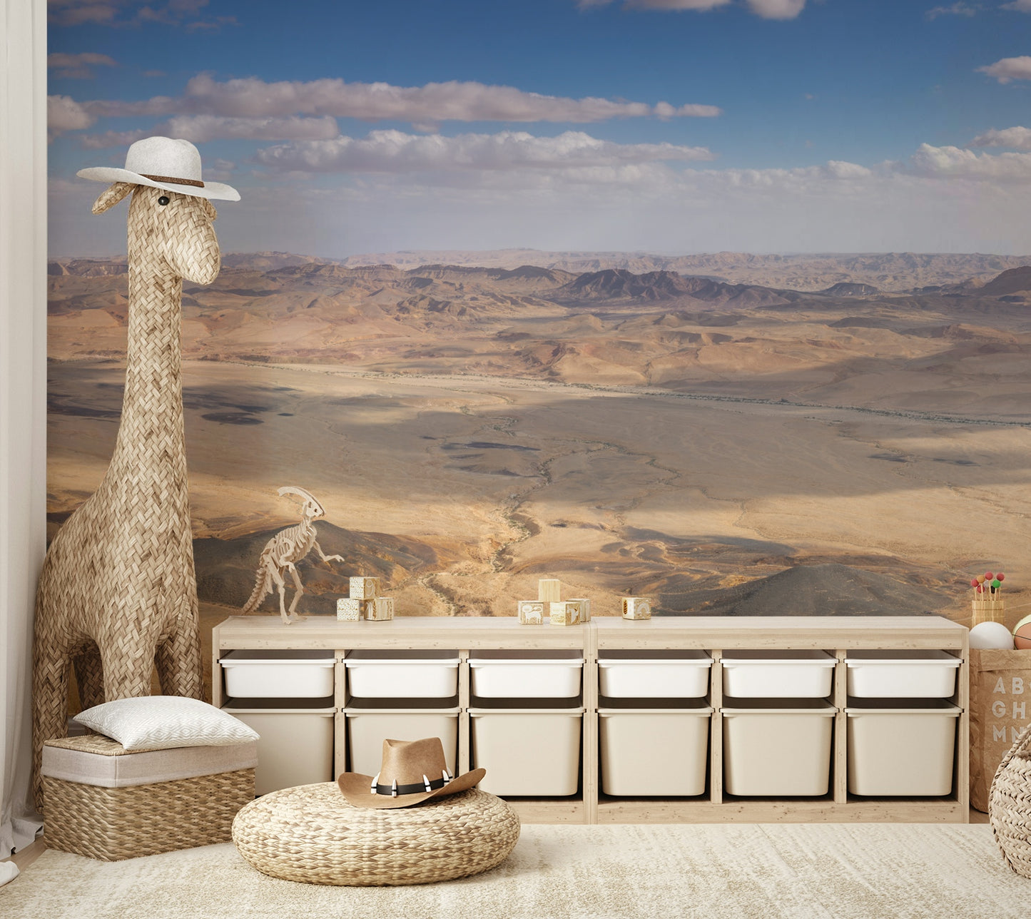 A wall mural with a panoramic desert scene.


