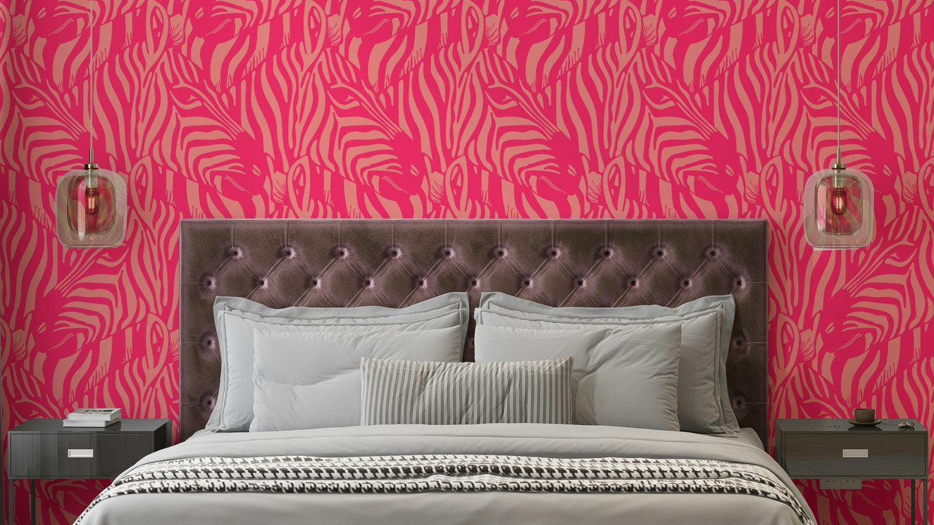A wall mural of a zebra herd with artistic stripes.

