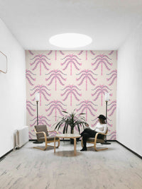 A wall mural of a tropical palm leaf pattern.

