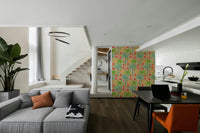 The colors are soft, muted tones of green, fuchsia, orange, and blue.

