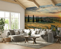 A wall mural of a rustic Italian farmhouse scene at sunset.
