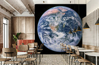 The continents are visible in shades of brown and green.
