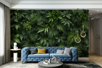 A wall mural depicting a dense wall of various types of green leaves.
