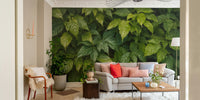 A wall mural depicting a dense and lush green forest.
