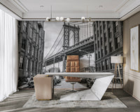 Several parked cars are visible along the cobblestone street.

