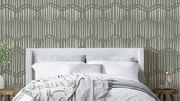 The image shows a full wall with a repeating design of gentle, wavy lines.

