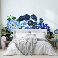 A detailed close-up of a blue and white floral wall mural.
