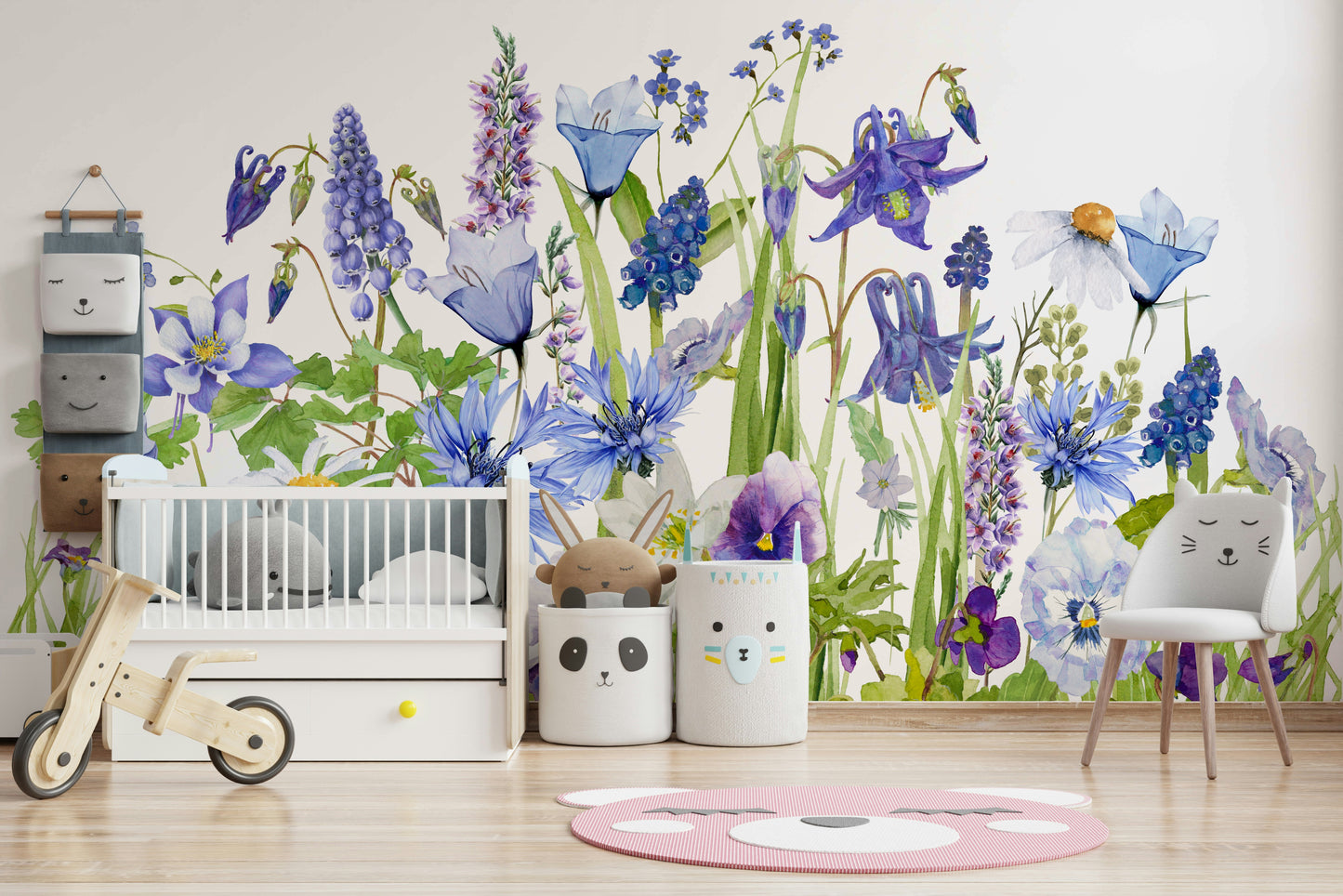 Wall mural with a blue watercolor wildflower meadow.

