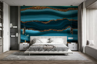Wall mural with a teal and gold river pattern.


