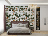 Horses grazing among trees and fences.

