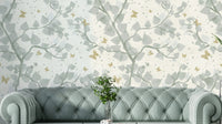 Wallpaper pattern with baby blue and gray tree branches.

