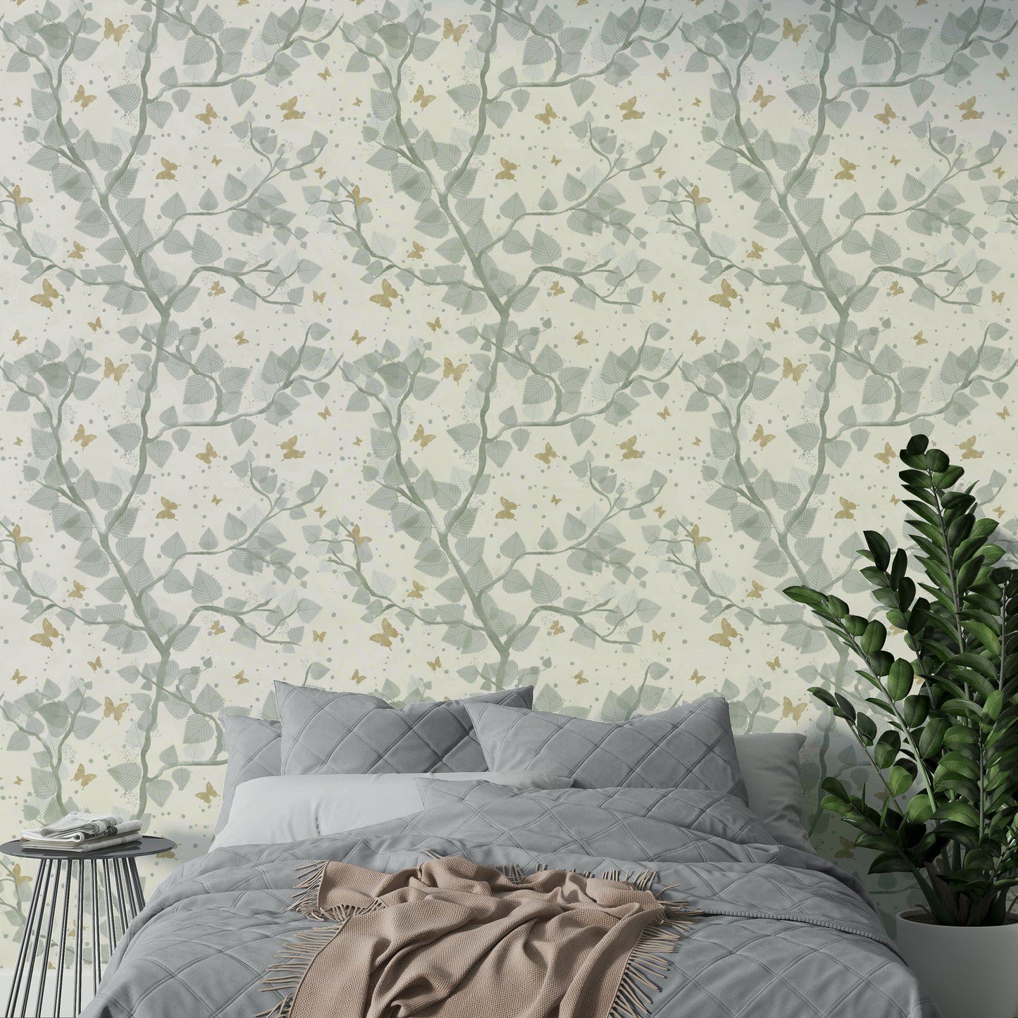 A seamless pattern of branches, leaves, and butterflies.

