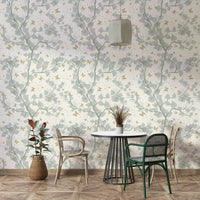 Delicate golden butterflies scattered on a light background.

