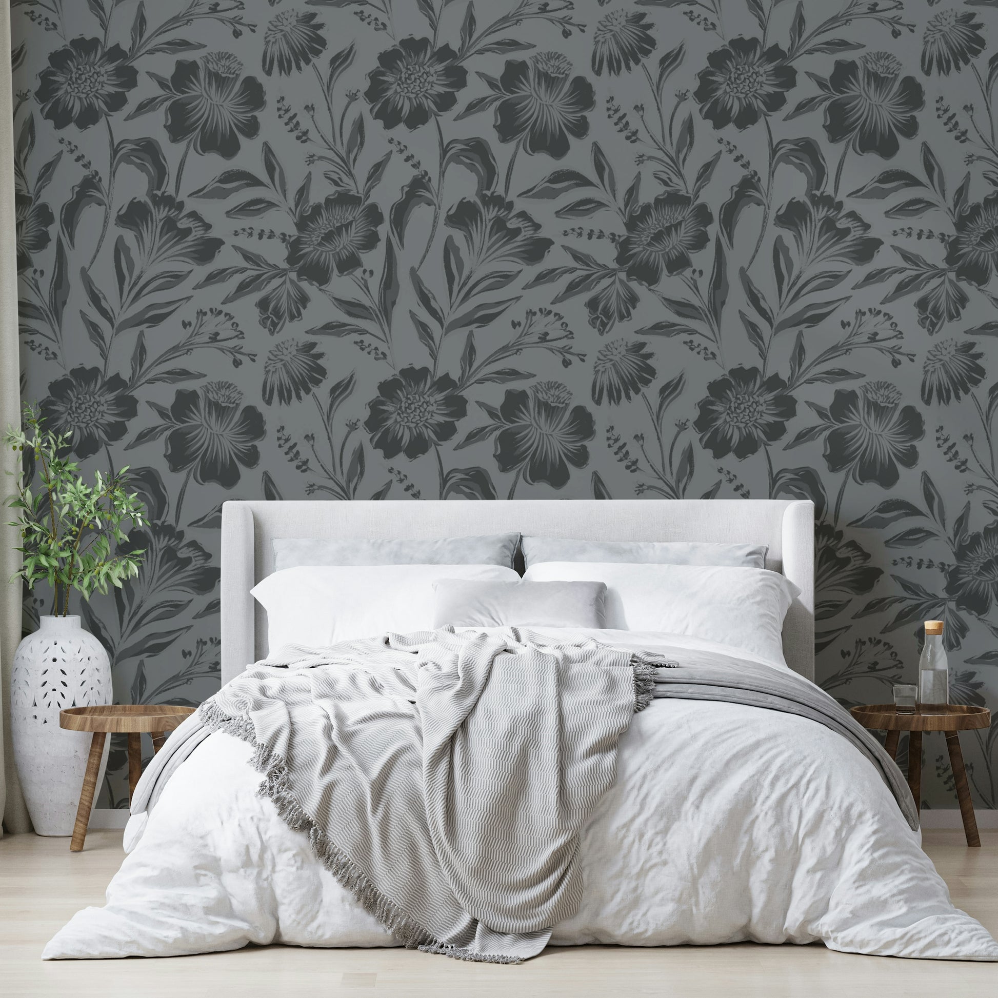 The image features large flower and leaf shapes shown as soft silhouettes.
