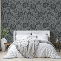 The image features large flower and leaf shapes shown as soft silhouettes.
