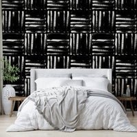 The image features abstract stripes that run vertically across the wall.
