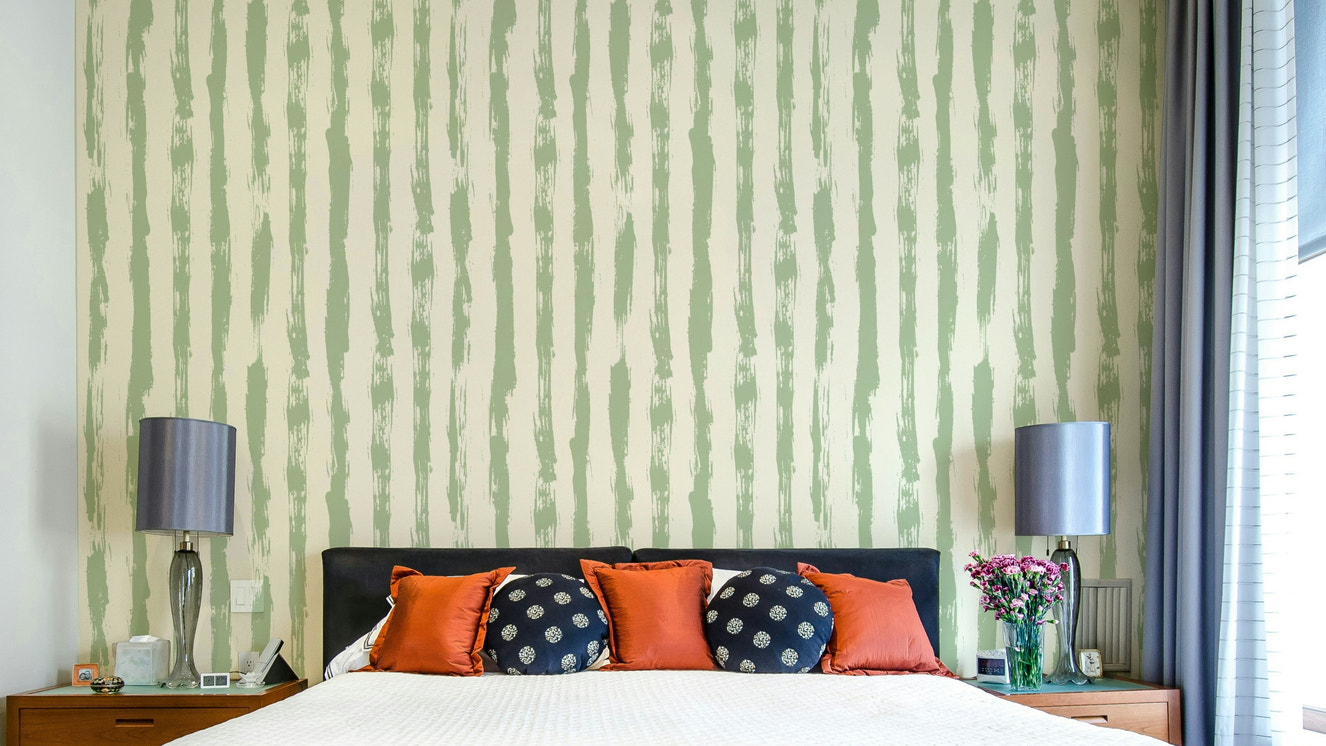 A full-wall mural showing a pattern of painted stripes.
