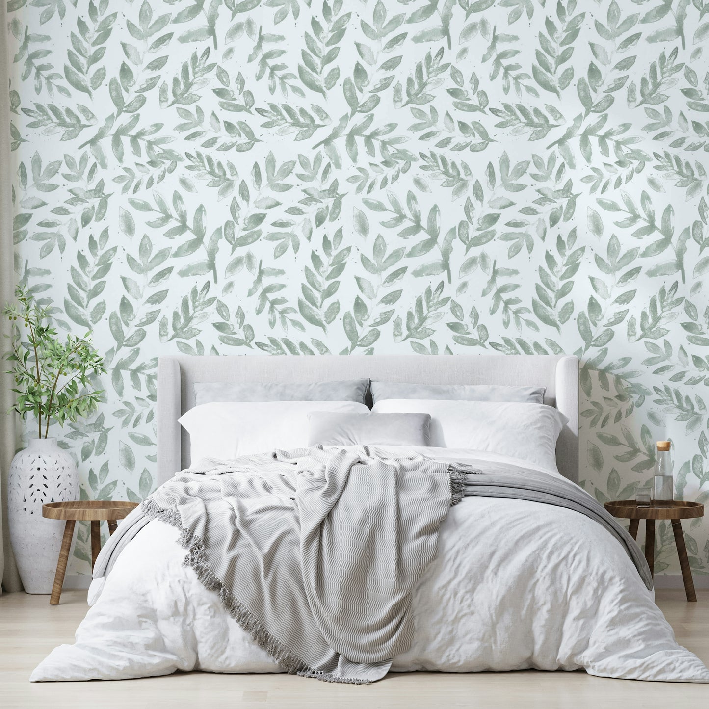 Various types of green leaves fill the spaces between the flowers.
