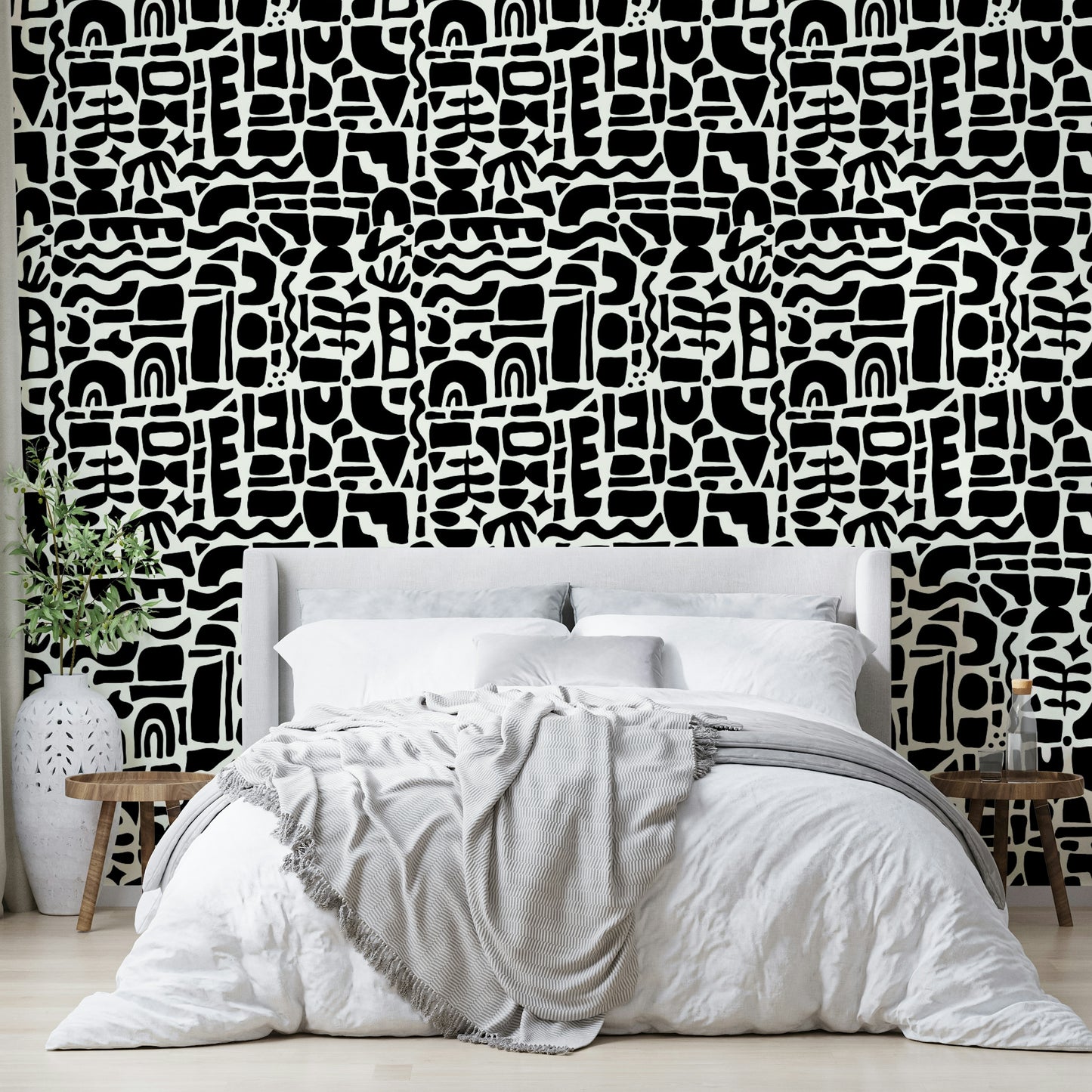 The design is an abstract collage of overlapping shapes.
