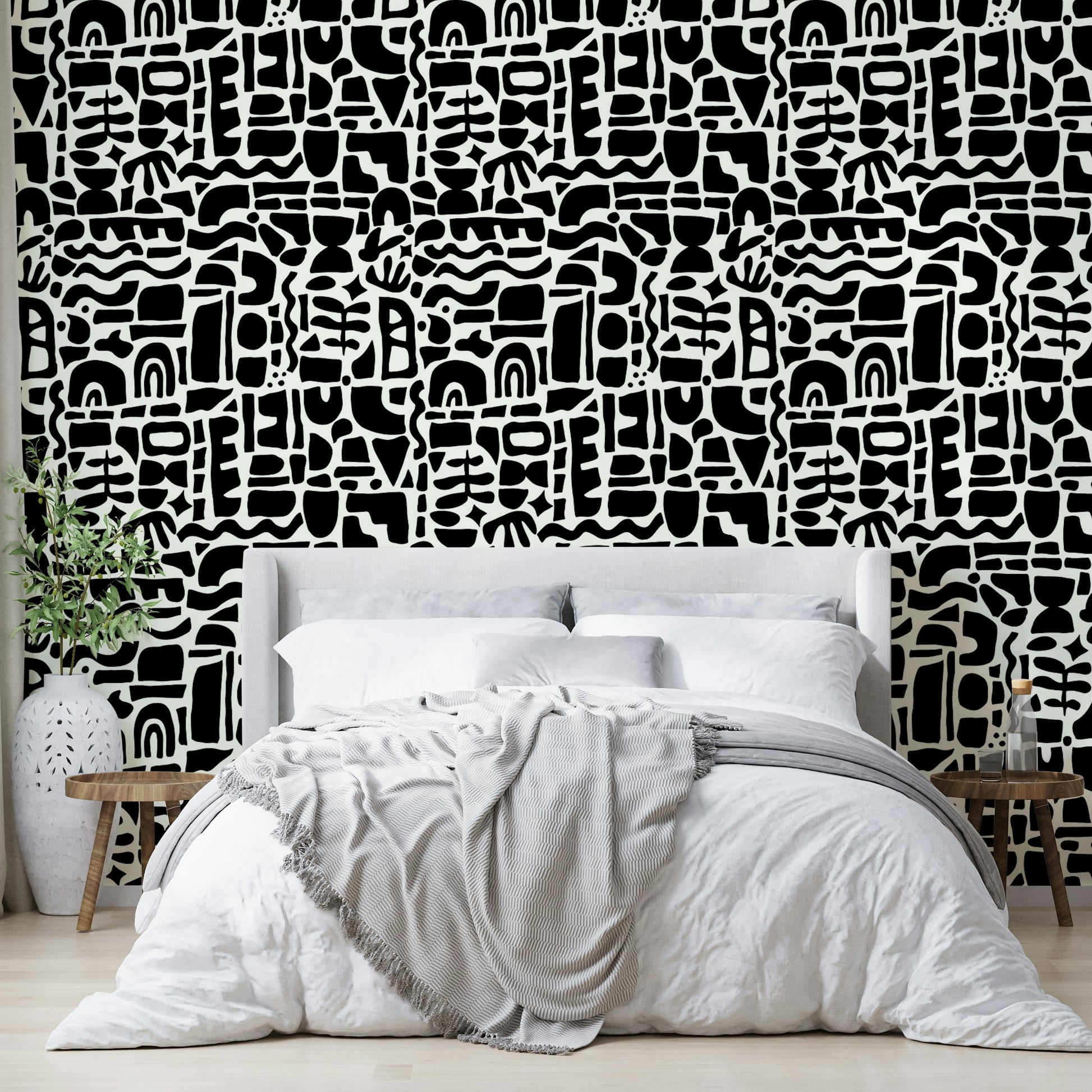 The design is an abstract collage of overlapping shapes.
