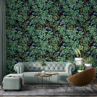 A bedroom decorated with a foliage mural

