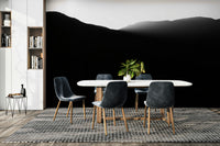 The wallpaper is used as a feature wall in a bedroom.

