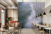 A bedroom with the wall mural behind the headboard.

