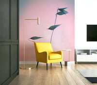 The wallpaper is used as a feature wall in a bedroom.

